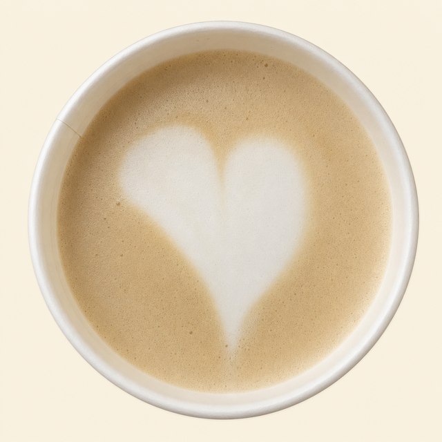 High-street takeaway latte with a plain foam heart, seen from above